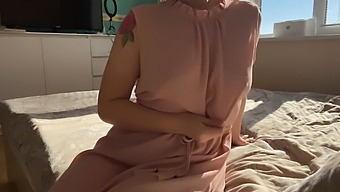 A Girl In A Pretty Pink Dress Explores Her Private Areas For Pleasure